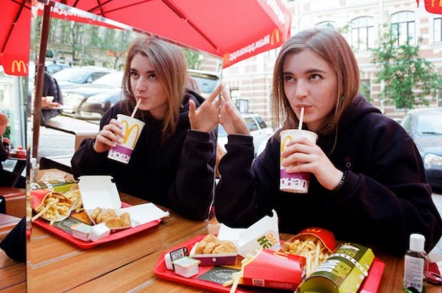 Woman drinking McDonald's beverage