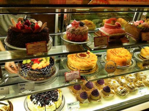 Cakes on glass display counter