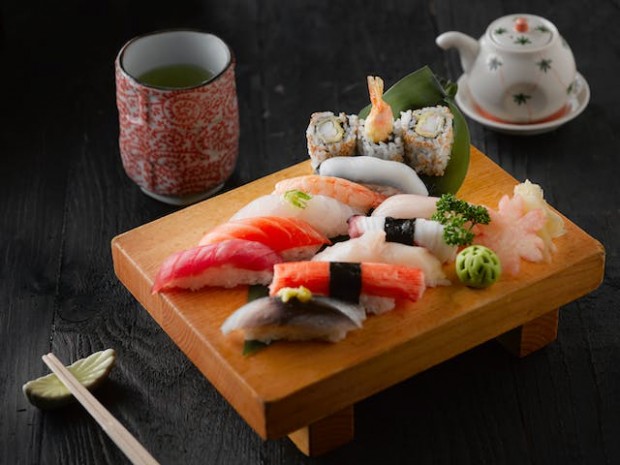 Sushi on a brown wooden board