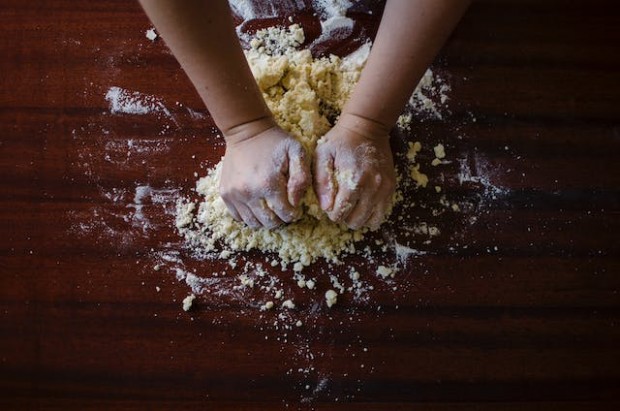 Person mixing dough