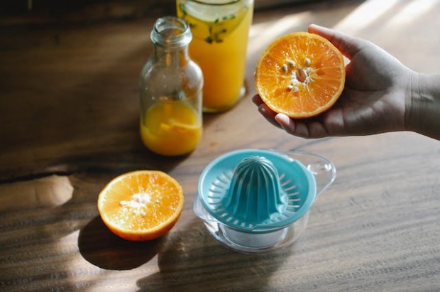 Person making an orange juice