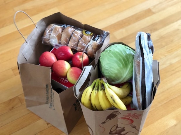 Apples and bananas in a cardboard box