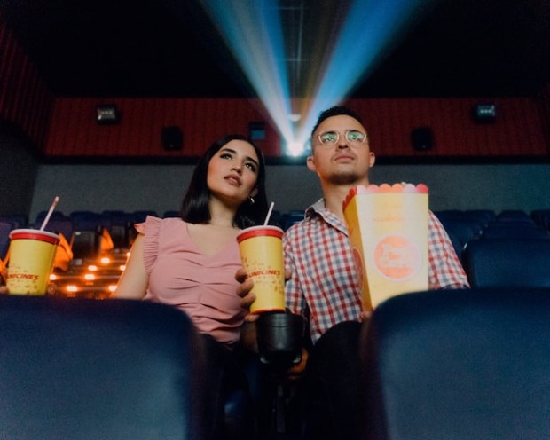 2 people watching in a cinema