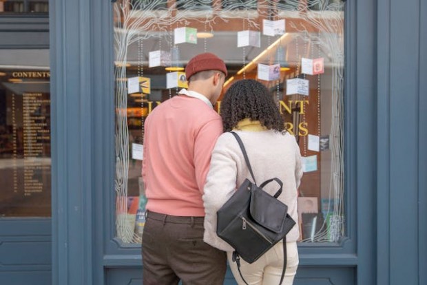 Couple standing infront of a book store