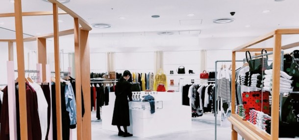 Woman standing inside a clothing area