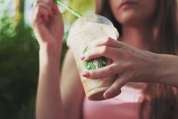 Woman drinking Starbucks