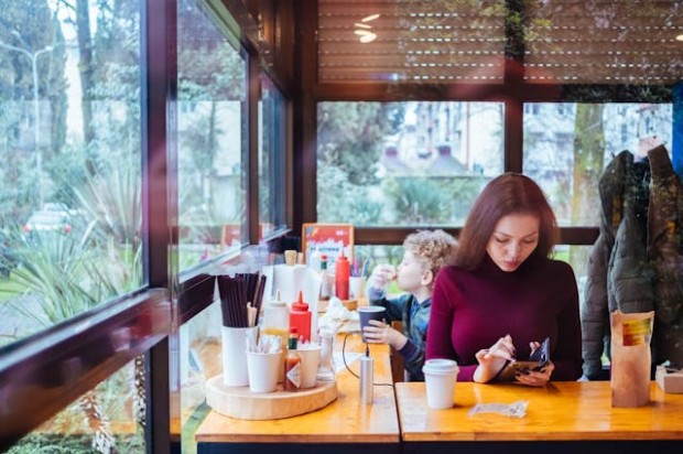 Woman using her phone in a restaurant