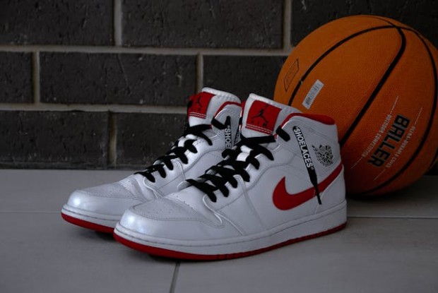 A pair of Nike shoes and a basketball ball