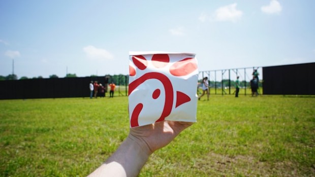 A person holding Chick-fil-A bag