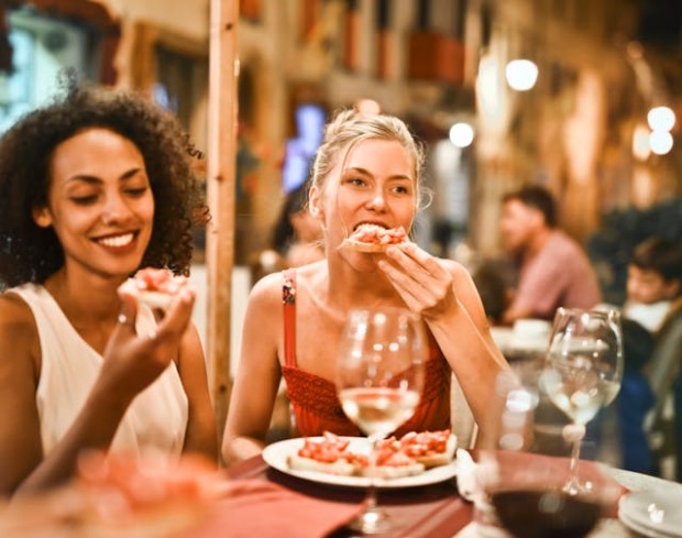 Two woman eating out