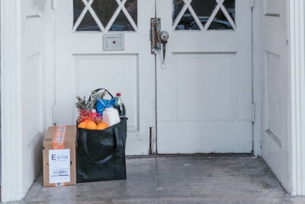 Groceries beside a door