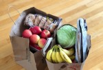 Apples and bananas in a cardboard box