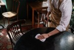 Waiter wiping the table
