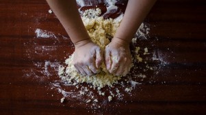 Person Mixing Dough