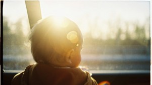 Baby looking through car window