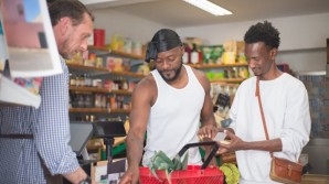Men paying for groceries