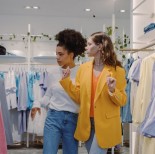 Young women shopping for clothes