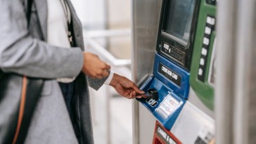 A women inserting card in the ATM machine