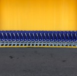 Arranged blue grocery carts