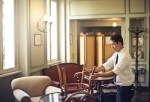 A waiter fixing the chair in a restaurant